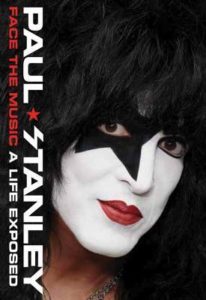 Cover of Face The Music: A Life Exposed. Photo of Paul Stanley wearing black and white KISS make-up, with a large black star over his left eye.