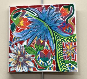 Painting of flowers in bold blues, reds and greens