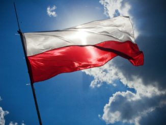 White and red Polish flag with sunlight shining through it