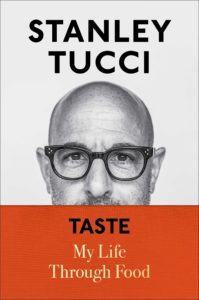 Cover of Taste: My Life Through Food. Photo of Stanley Tucci that shows the top half of his face. A red band with the book's title covers the bottom half of his face.